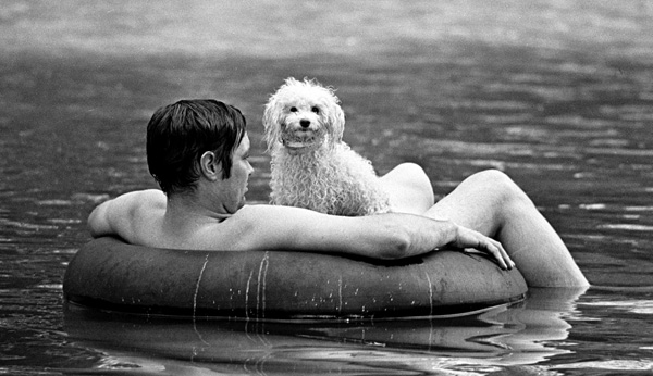 Man and his dog cool off in the Ozarks 1976